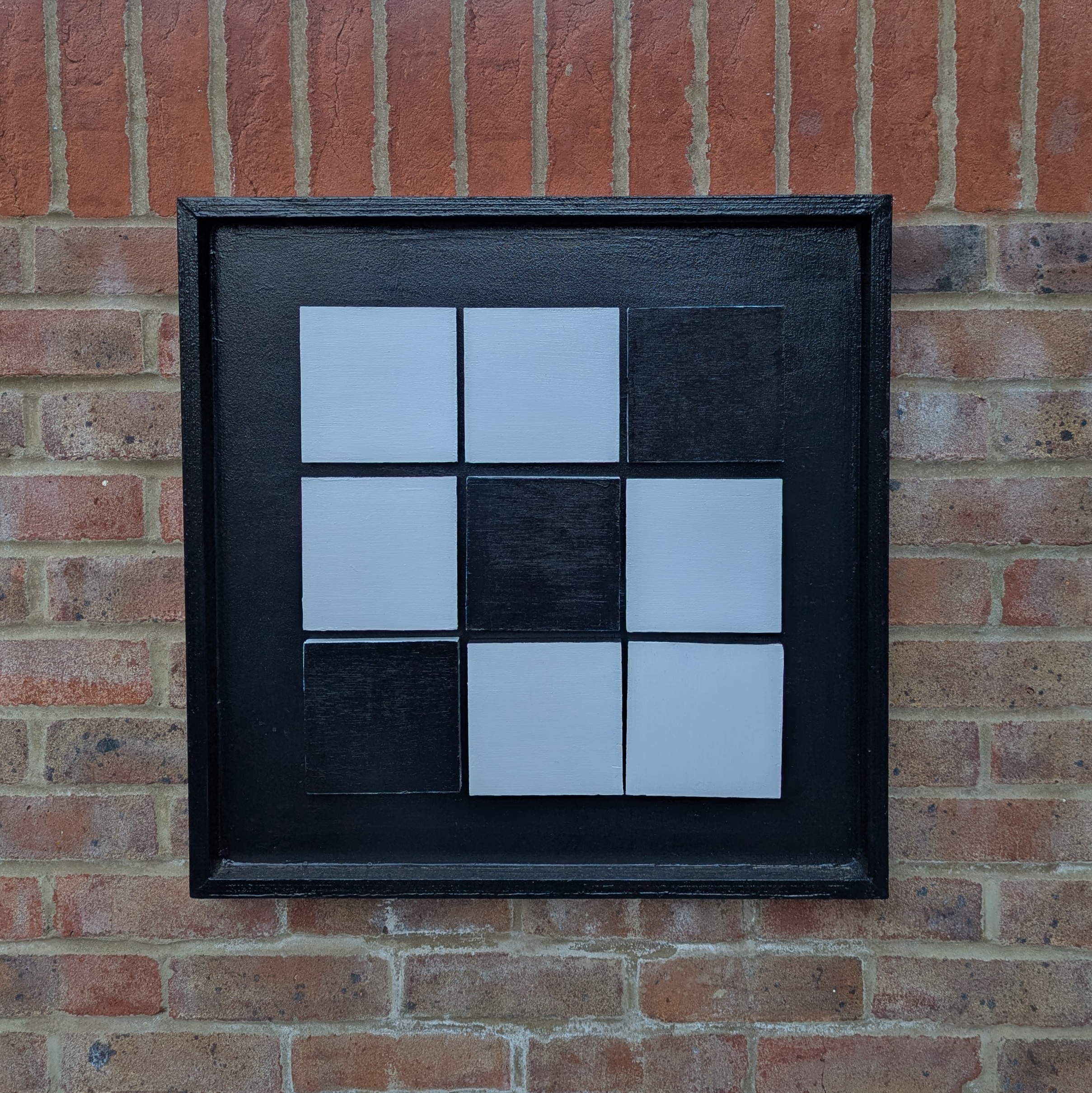 Black vision board with connecting white squares.