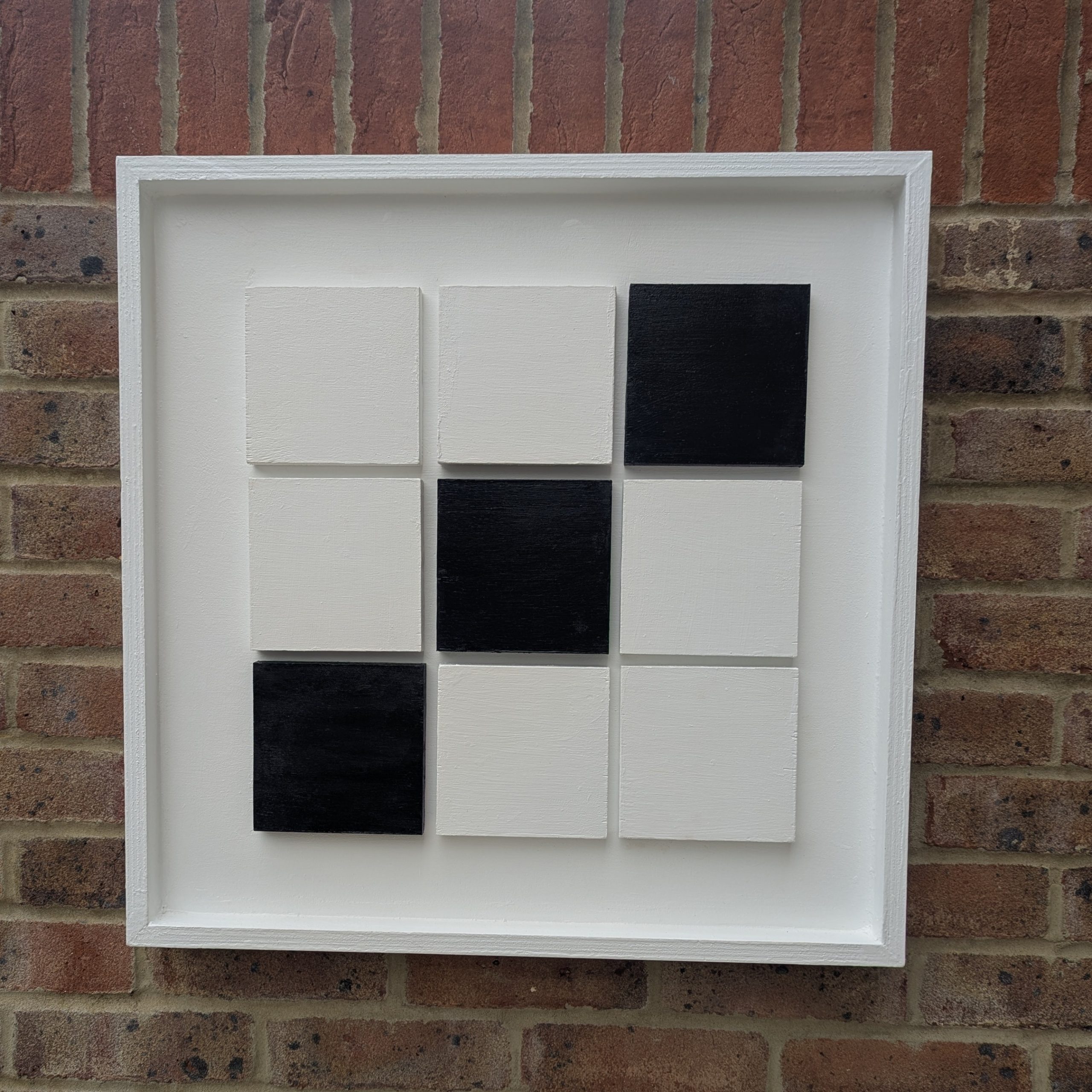 Connecting line of three black squares showing a 'leap of faith' design concept on white background.